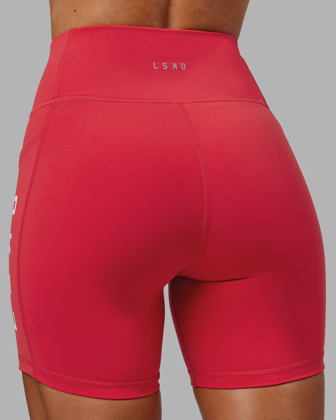 Woman wearing Rep Mid-Length Shorts - Scarlet-White