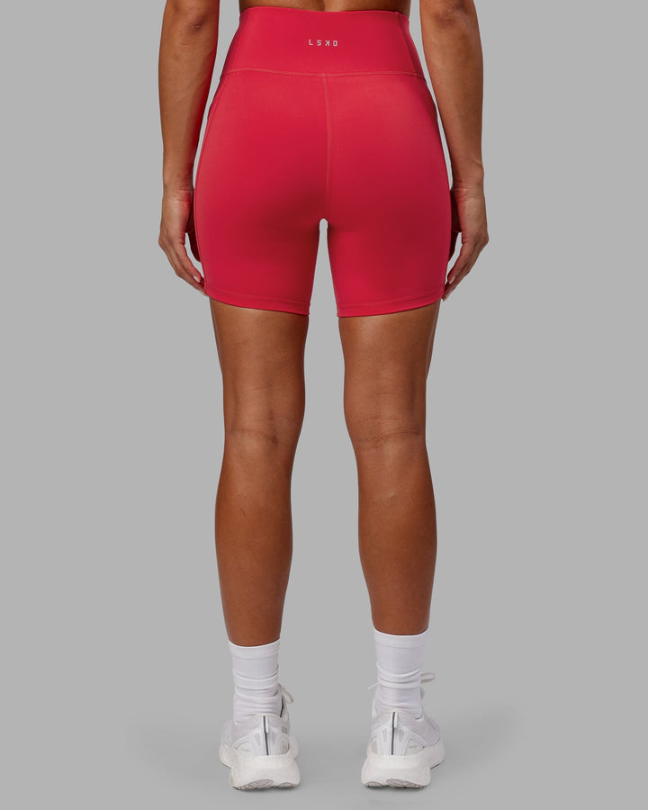 Woman wearing Rep Mid-Length Shorts - Scarlet-White
