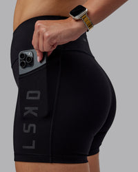 Woman wearing Rep Ultra High-Rise 4" Short Pockets - Black-Black