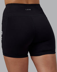 Woman wearing Rep Ultra High-Rise 4" Short Pockets - Black-White