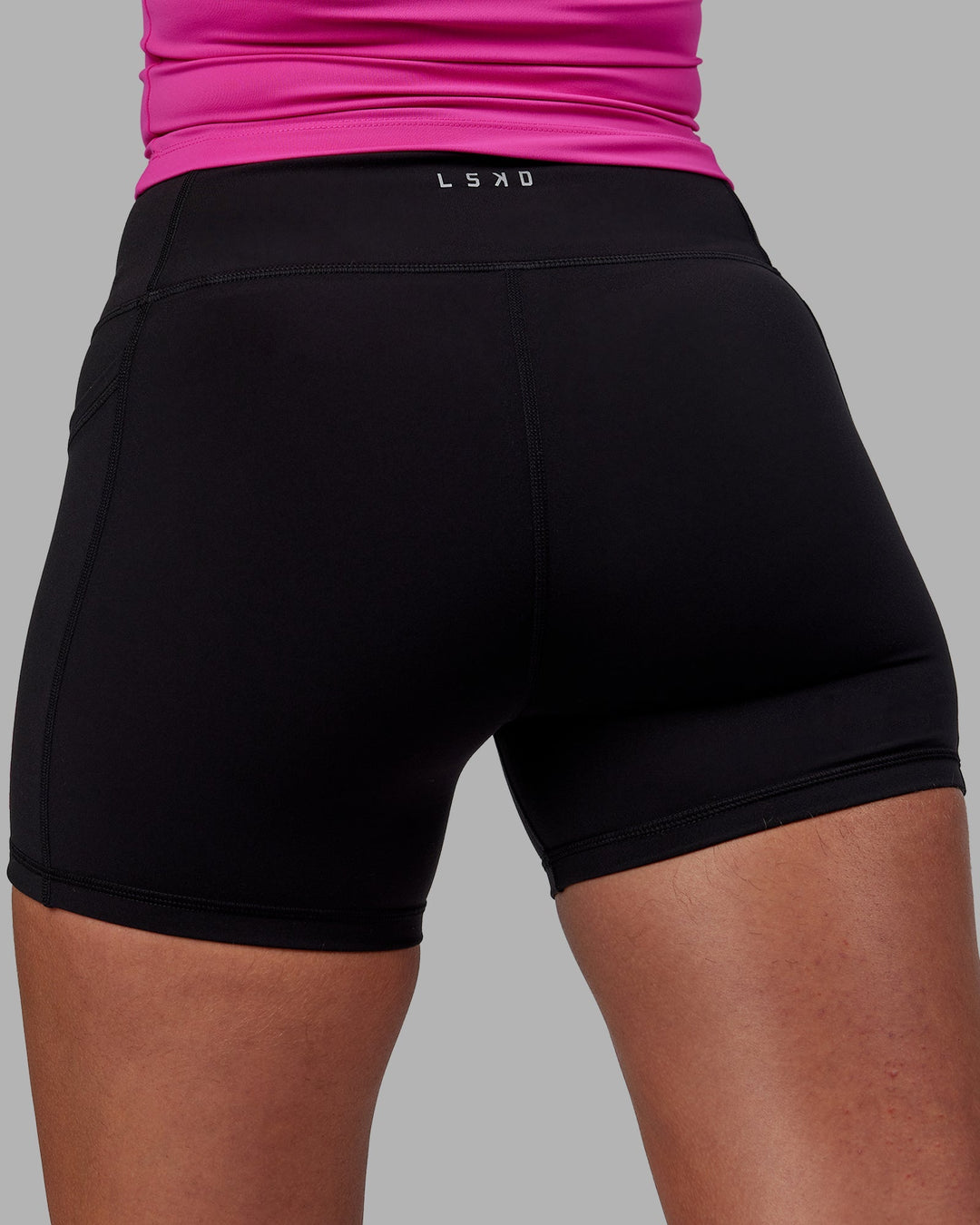 Woman wearing Rep X-Length Shorts - Black-Fuchsia Pink