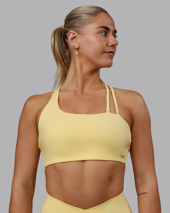 Woman wearing Sara Helios Sports Bra - Sunflower
