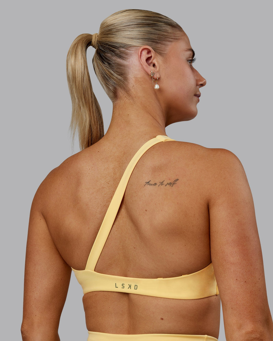 Woman wearing Sara Helios Sports Bra - Sunflower