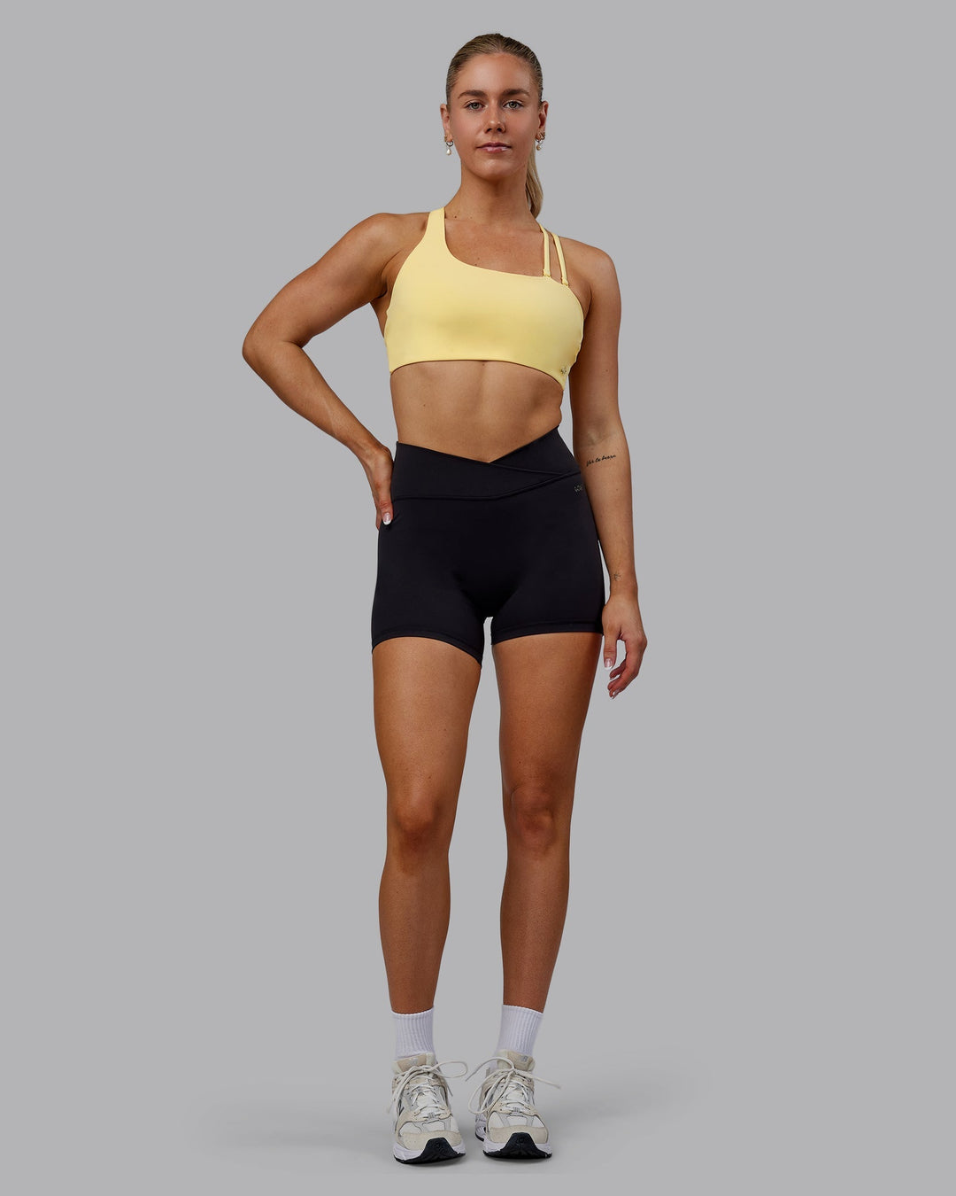 Woman wearing Sara Helios Sports Bra - Sunflower