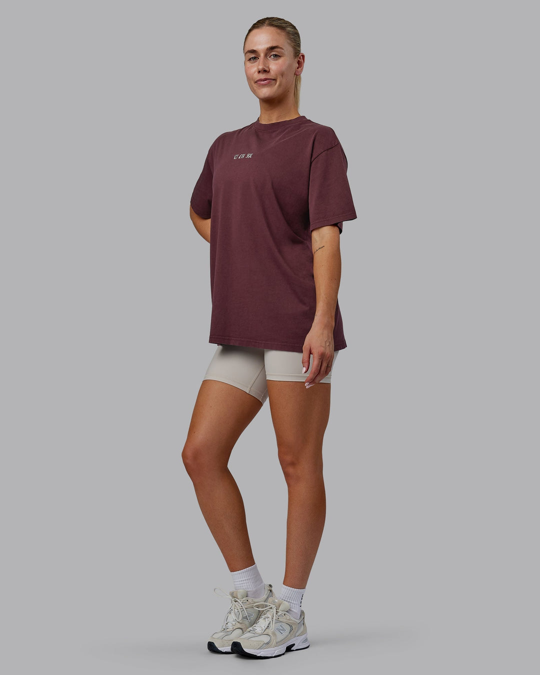 Woman wearing Sara I Can Shall &amp; Will Oversized Washed Tee - Bordeaux-Shale Beige