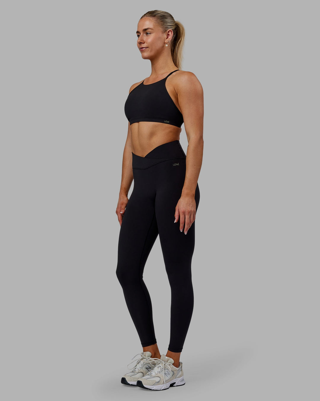 Woman wearing Sara Strike Cross Over Waist Full Length Leggings - Black