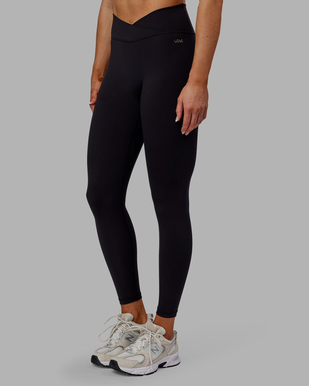 Woman wearing Sara Strike Cross Over Waist Full Length Leggings - Black