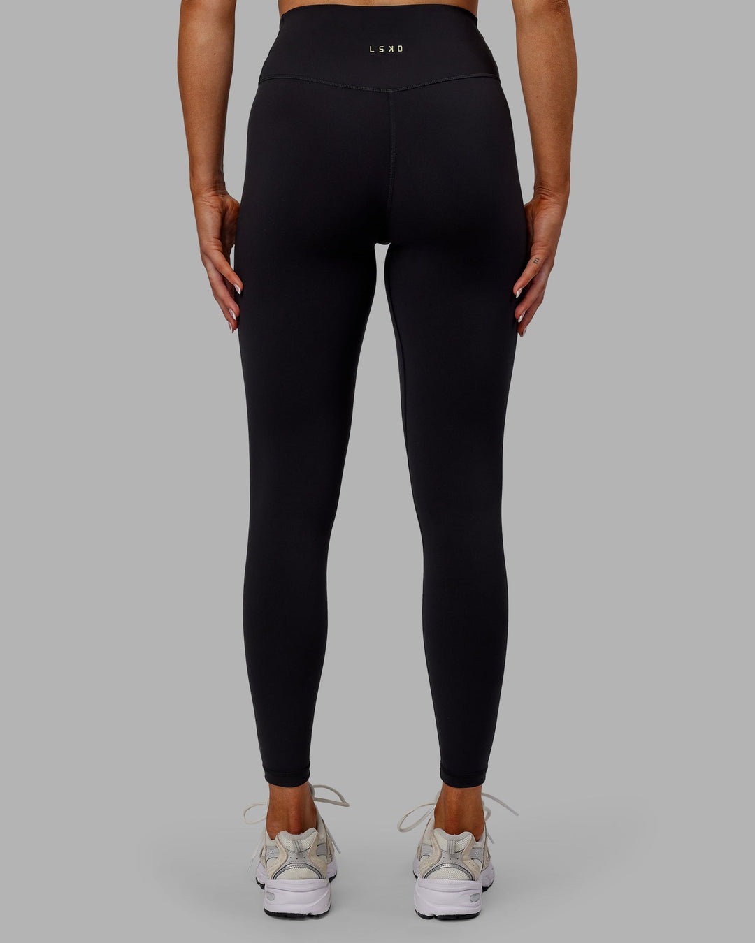 Woman wearing Sara Strike Cross Over Waist Full Length Leggings - Black