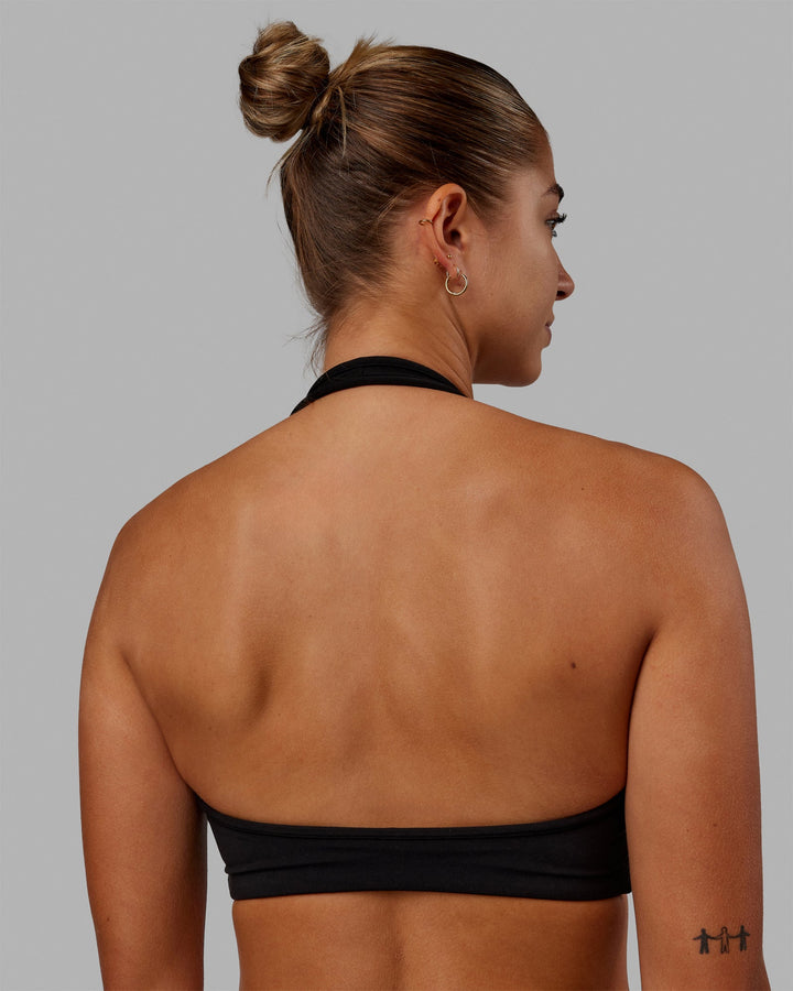 Woman wearing Stamina Halter Sports Bra - Black