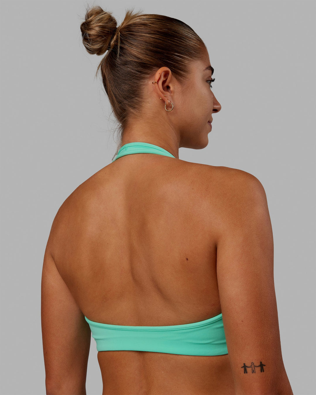 Woman wearing Stamina Halter Sports Bra - Cockatoo