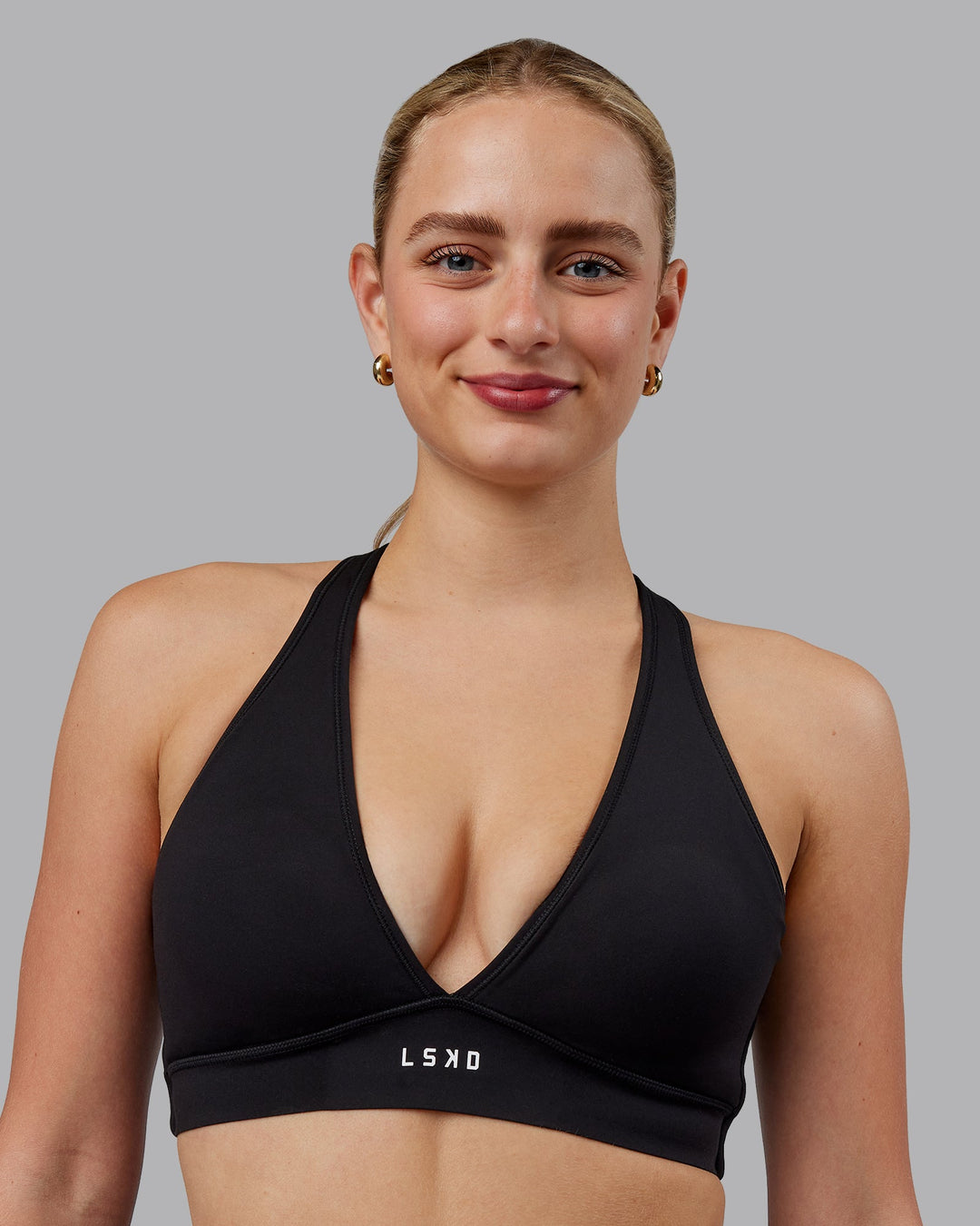 Woman wearing Stamina Sports Bra (D/DD/E) - Black | Model:Lillie | Size:S