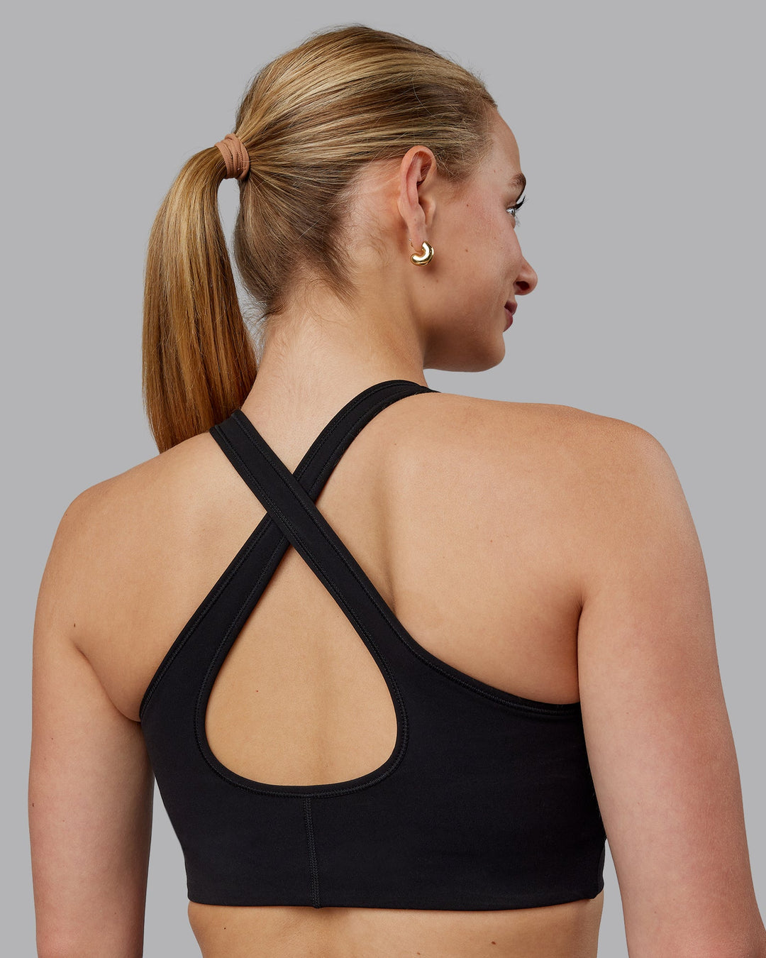 Woman wearing Stamina Sports Bra (D/DD/E) - Black | Model:Lillie | Size:S