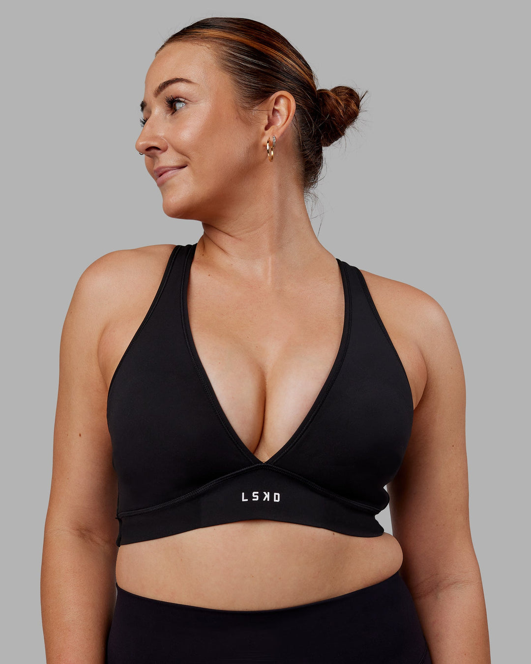 Woman wearing Stamina Sports Bra (D/DD/E) - Black | Model:Tegan | Size:M