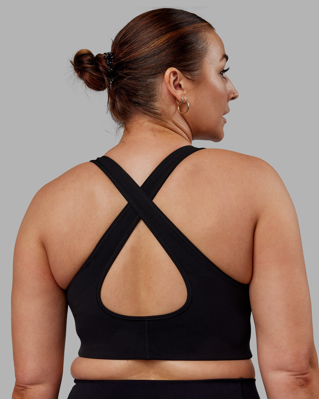 Woman wearing Stamina Sports Bra (D/DD/E) - Black | Model:Tegan | Size:M