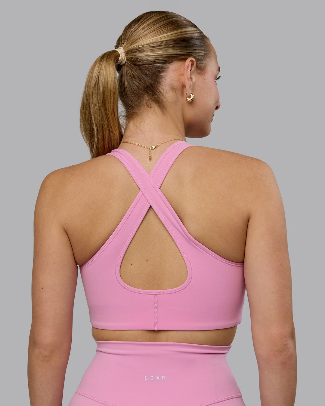 Woman wearing Stamina Sports Bra (D/DD/E) - Bubblegum