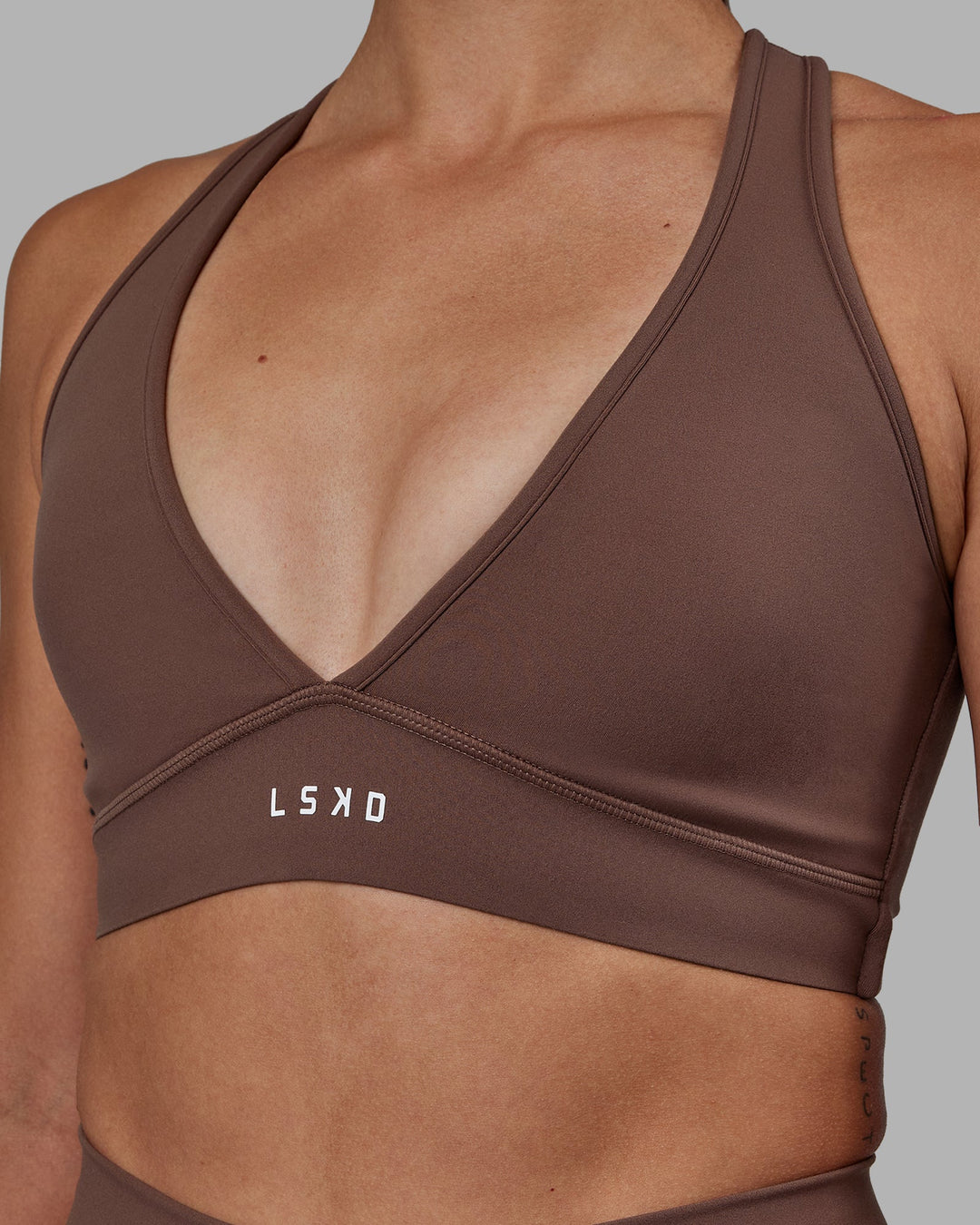 Woman wearing Stamina Sports Bra - Dull Rust