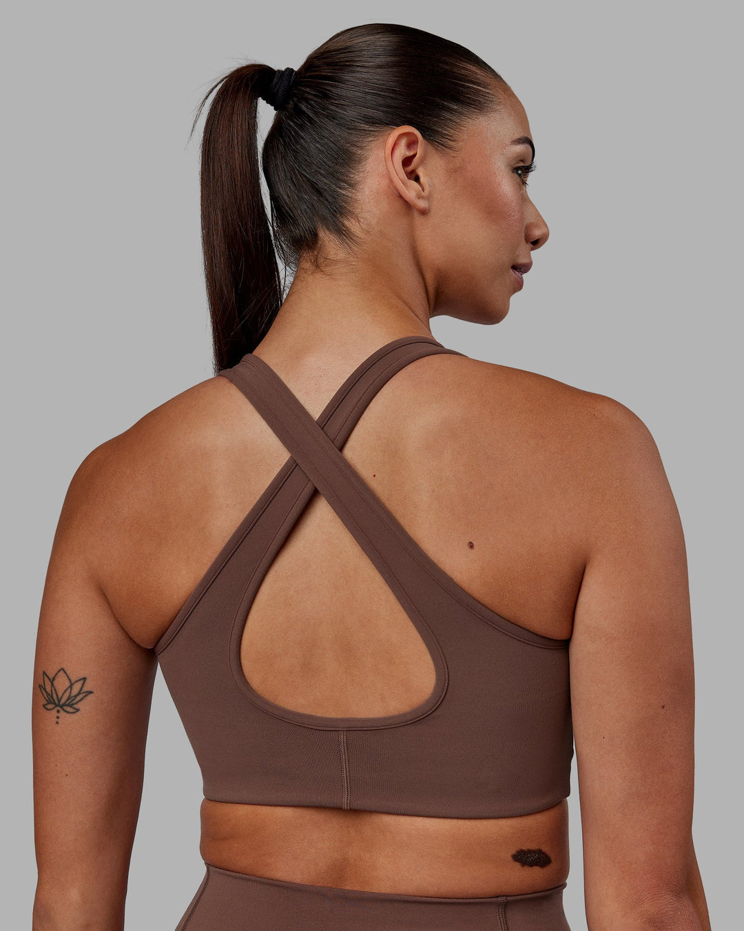 Woman wearing Stamina Sports Bra - Dull Rust