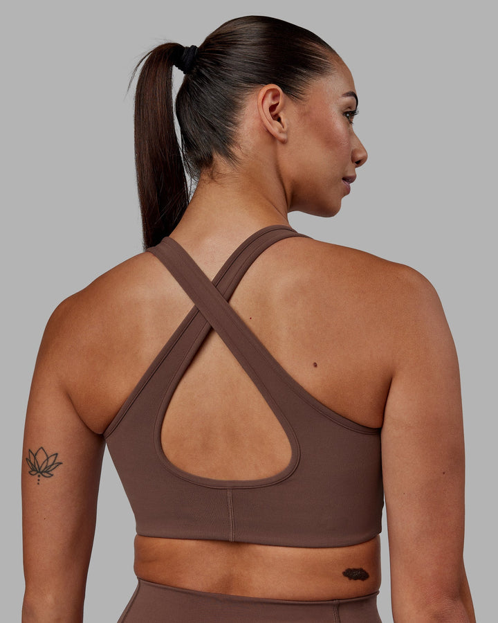 Woman wearing Stamina Sports Bra - Dull Rust
