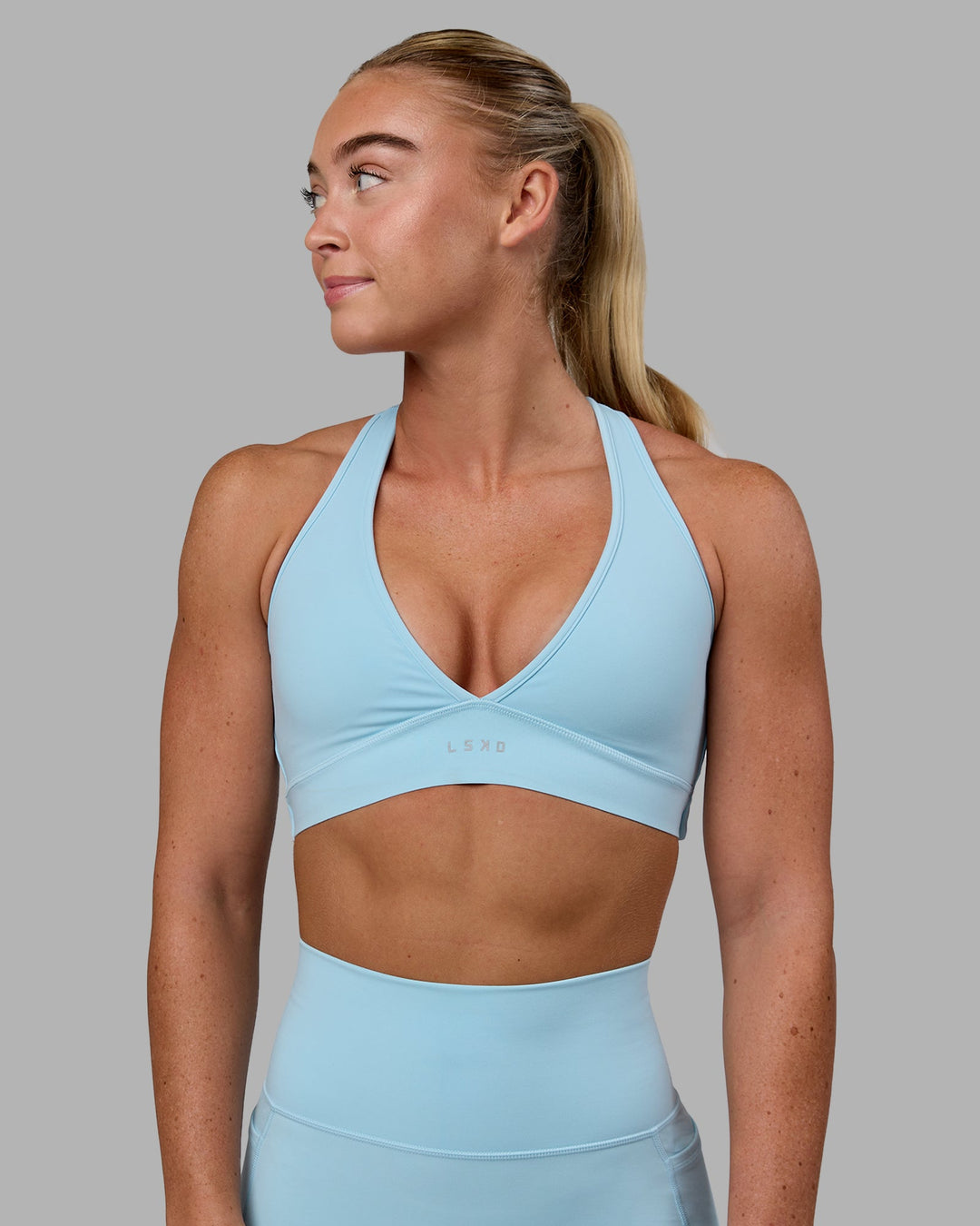 Woman wearing Stamina Sports Bra - Glacial Blue