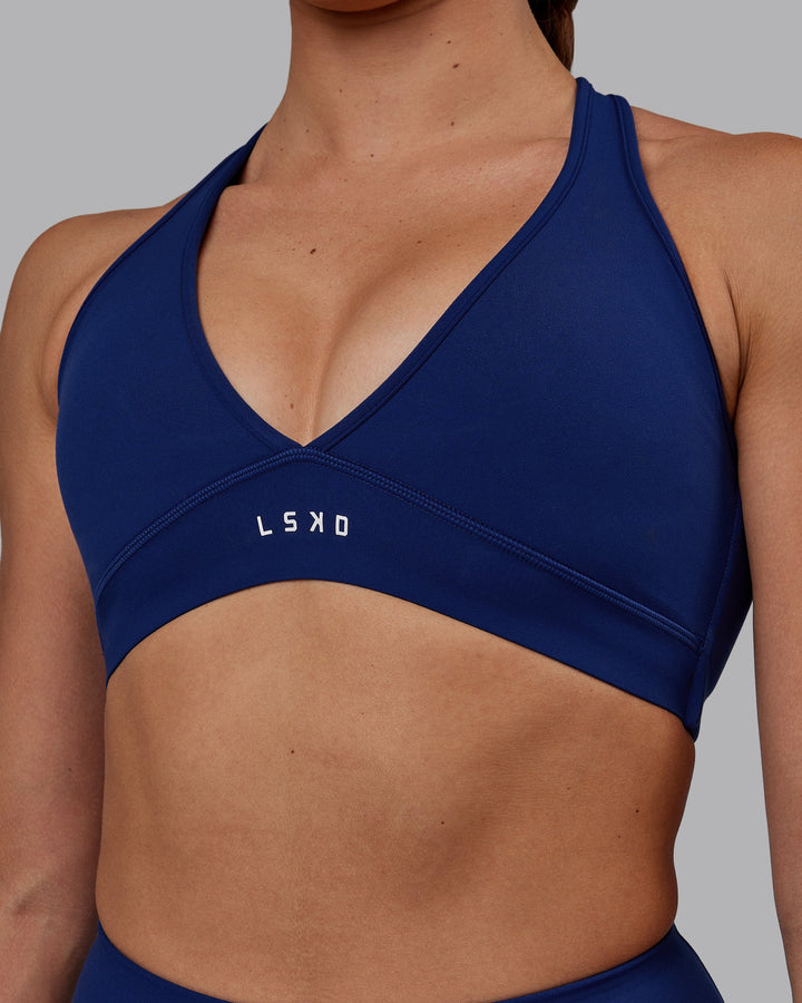 Woman wearing Stamina Sports Bra - Midnight Blue
