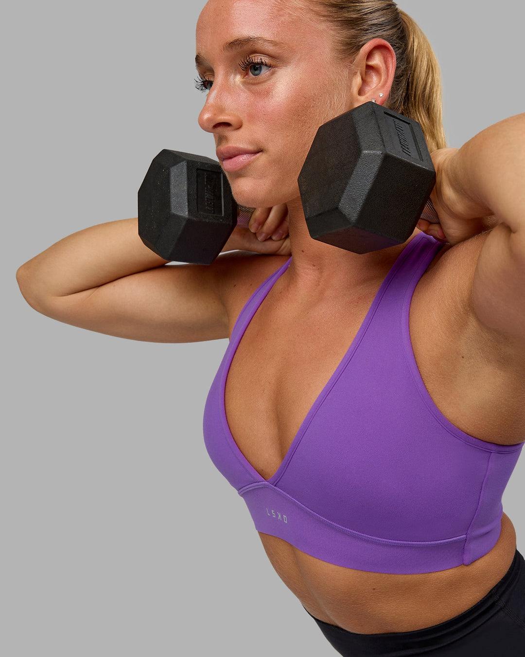 Woman wearing Stamina Sports Bra - Purple Swirl