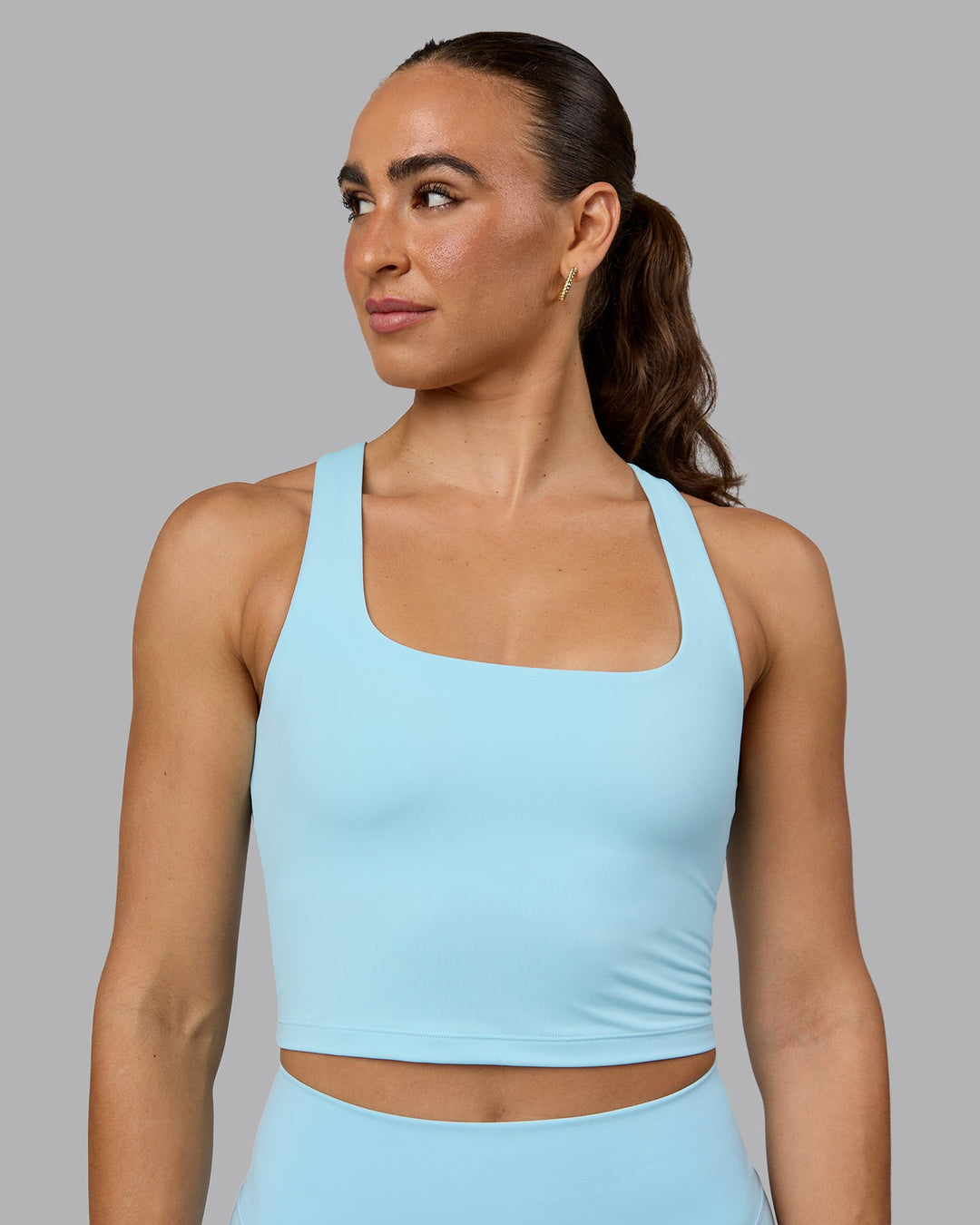 Woman wearing Staple Square Neck Active Shelf Bra Tank - Crystal Blue