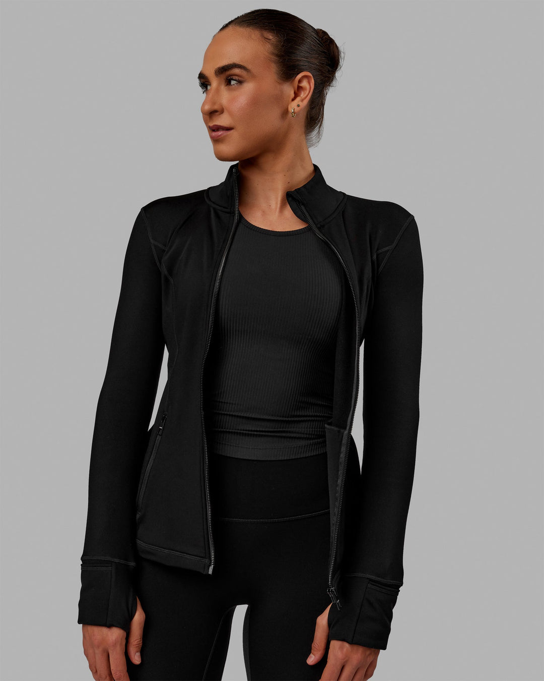 Woman wearing Stride Zip Through Thermal Jacket - Black