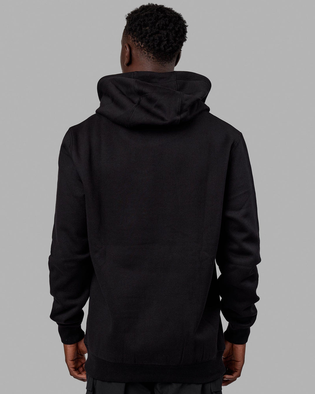 Man wearing Unisex Structure Hoodie - Black-White