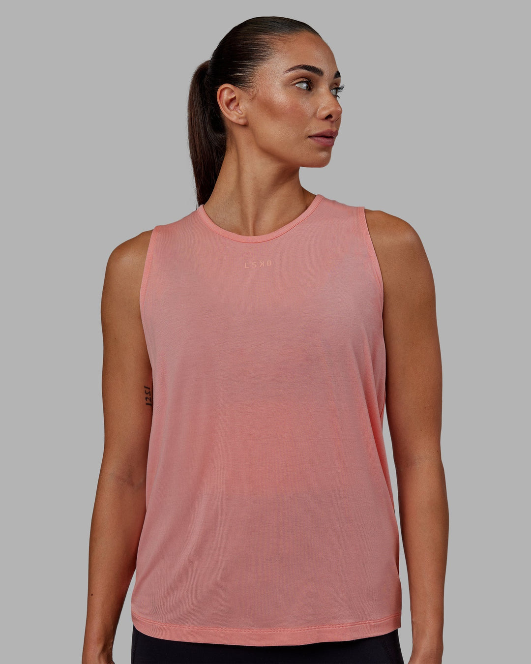 Woman wearing Swivel Open Back Tank - Murex Shell