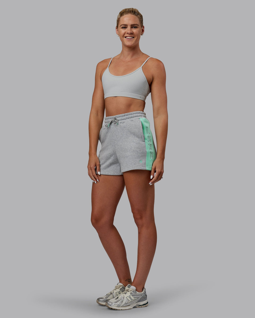 Woman wearing Tenacity Ribbed Lounge Bra - Light Grey Marl