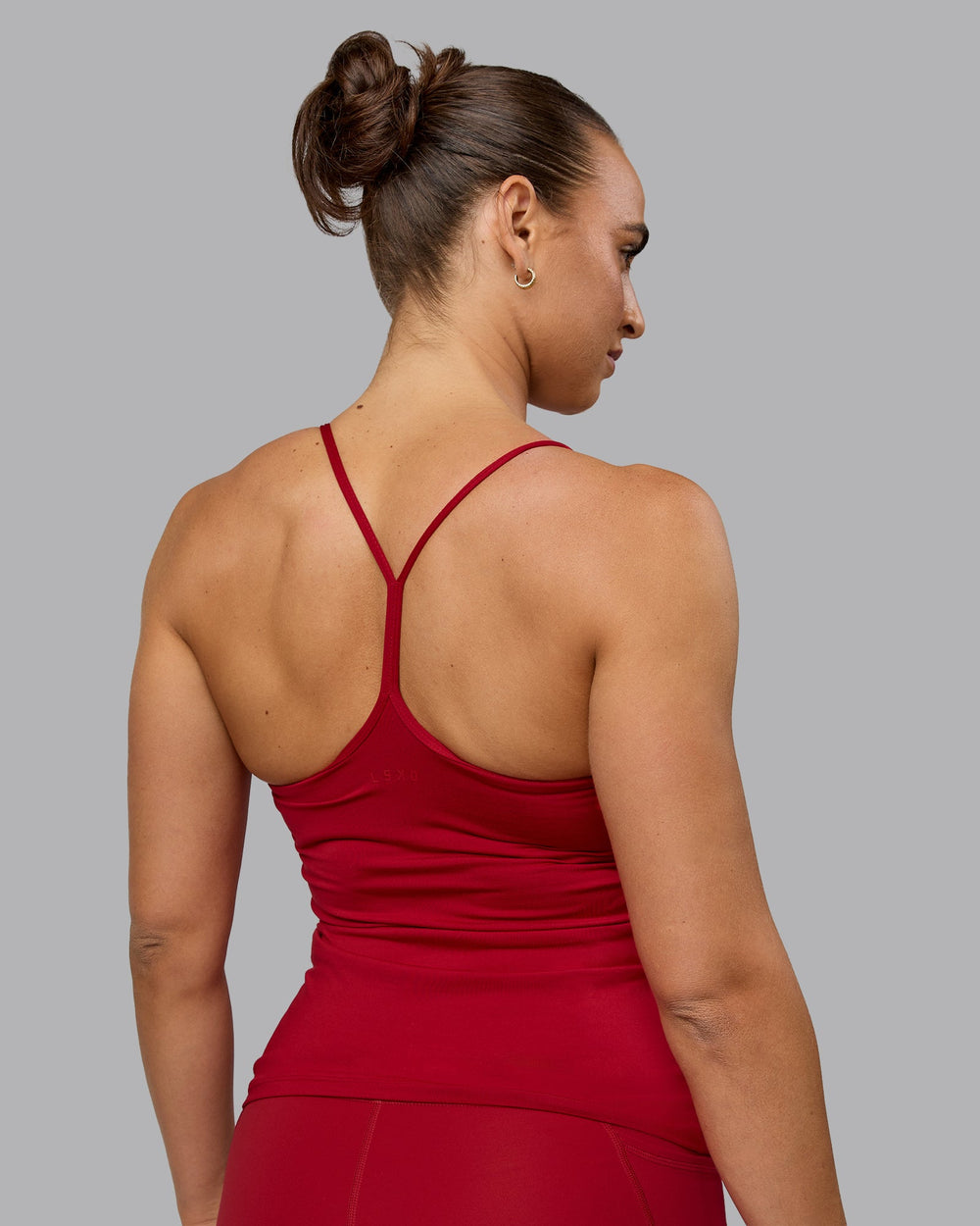 Woman wearing Transition CloudFLX Shelf Bra Tank - Cherry Red