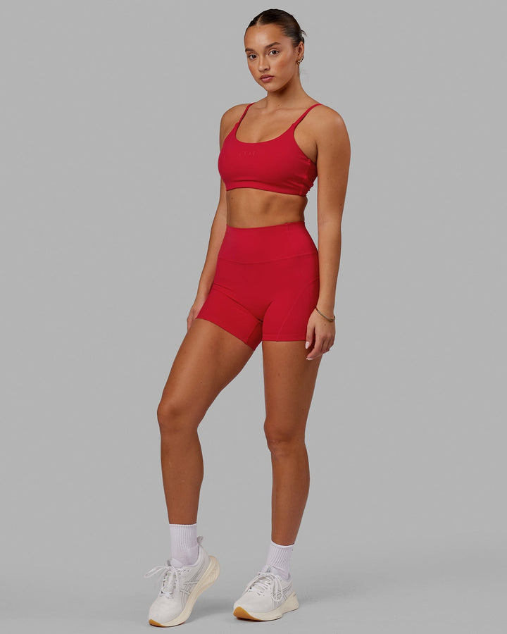 Woman wearing Twist Sports Bra - Scarlet
