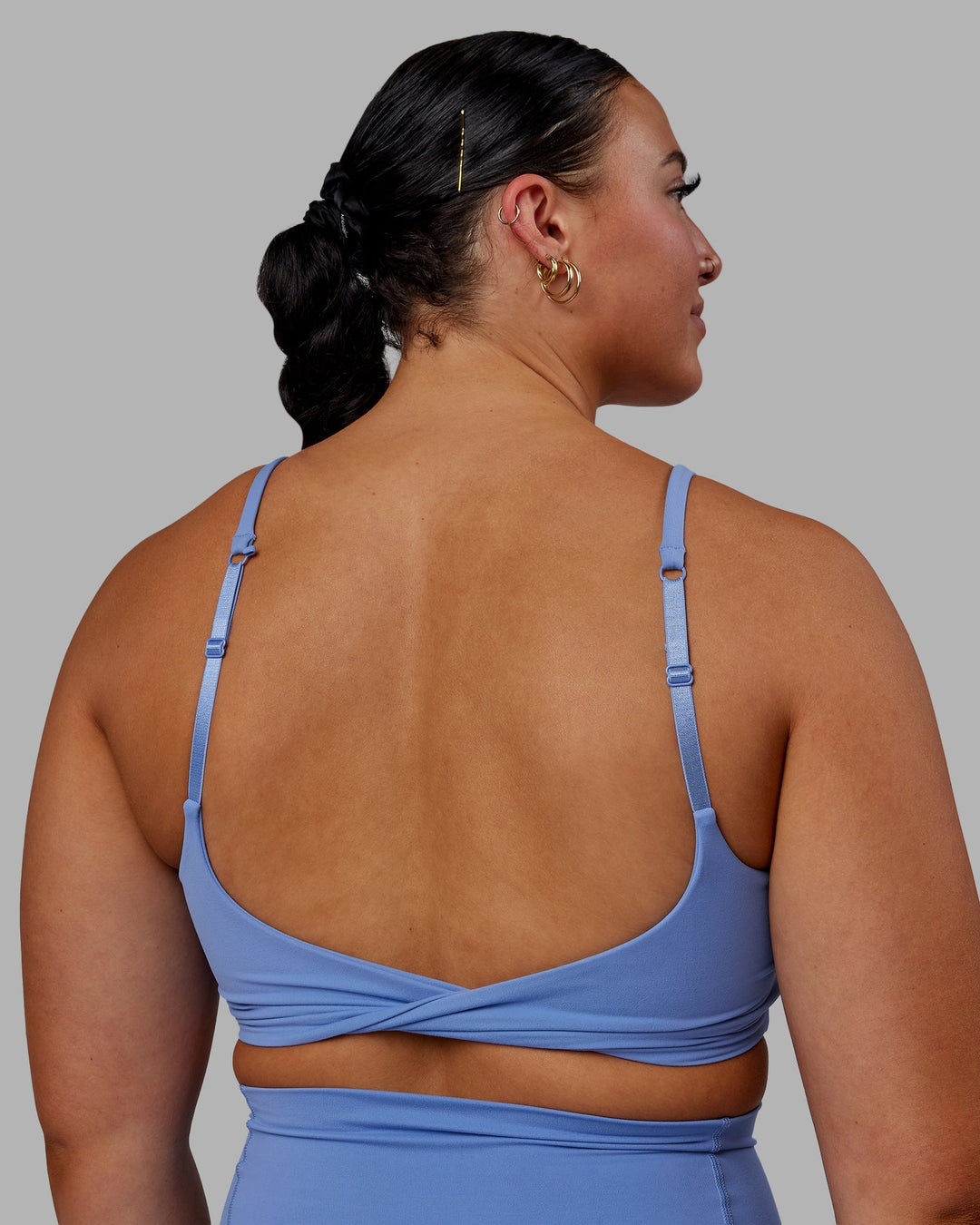 Woman wearing Twist Sports Bra - Ultramarine