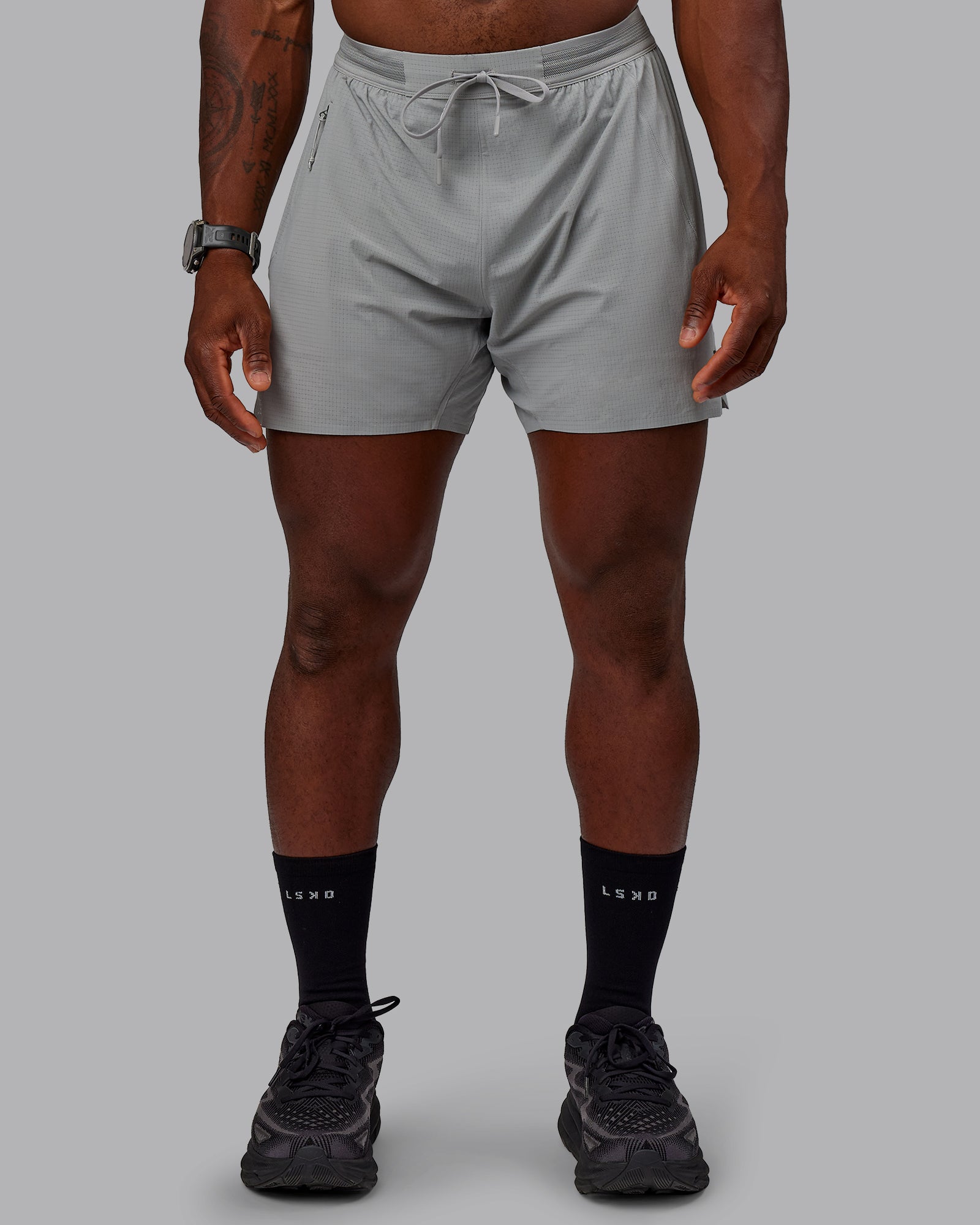 Man wearing UltraAir 5" Lined Performance Shorts - Circular Grey