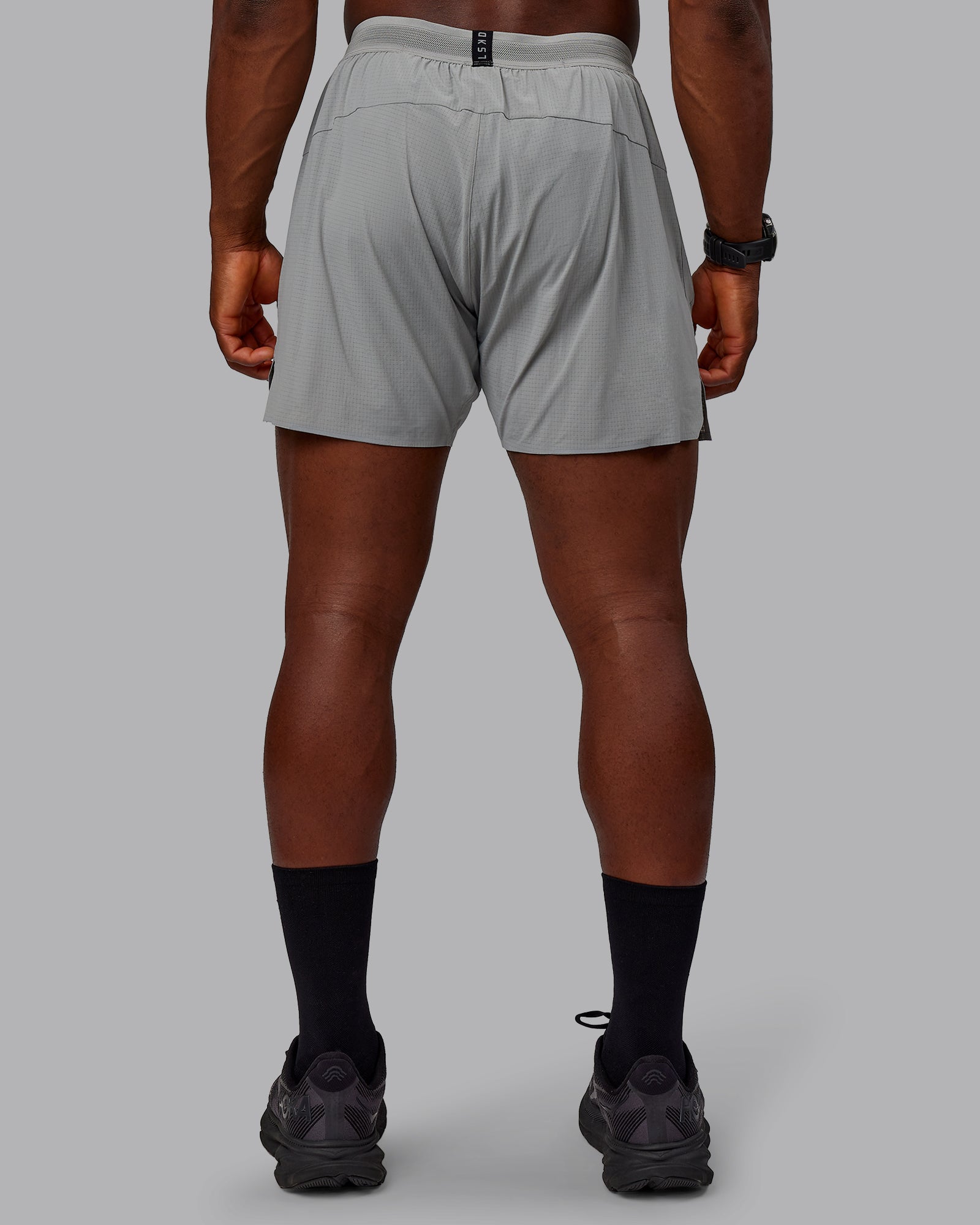 Man wearing UltraAir 5" Lined Performance Shorts - Circular Grey