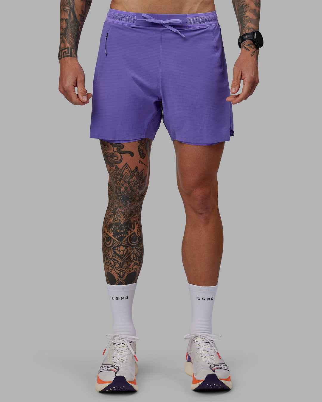 Man wearing UltraAir 5&quot; Lined Performance Shorts - Dahlia Purple