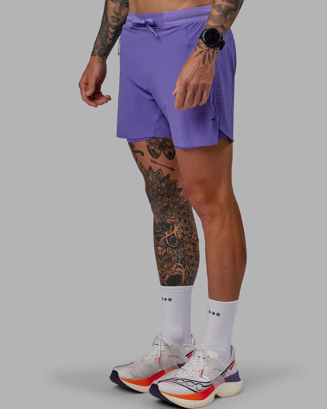 Man wearing UltraAir 5&quot; Lined Performance Shorts - Dahlia Purple