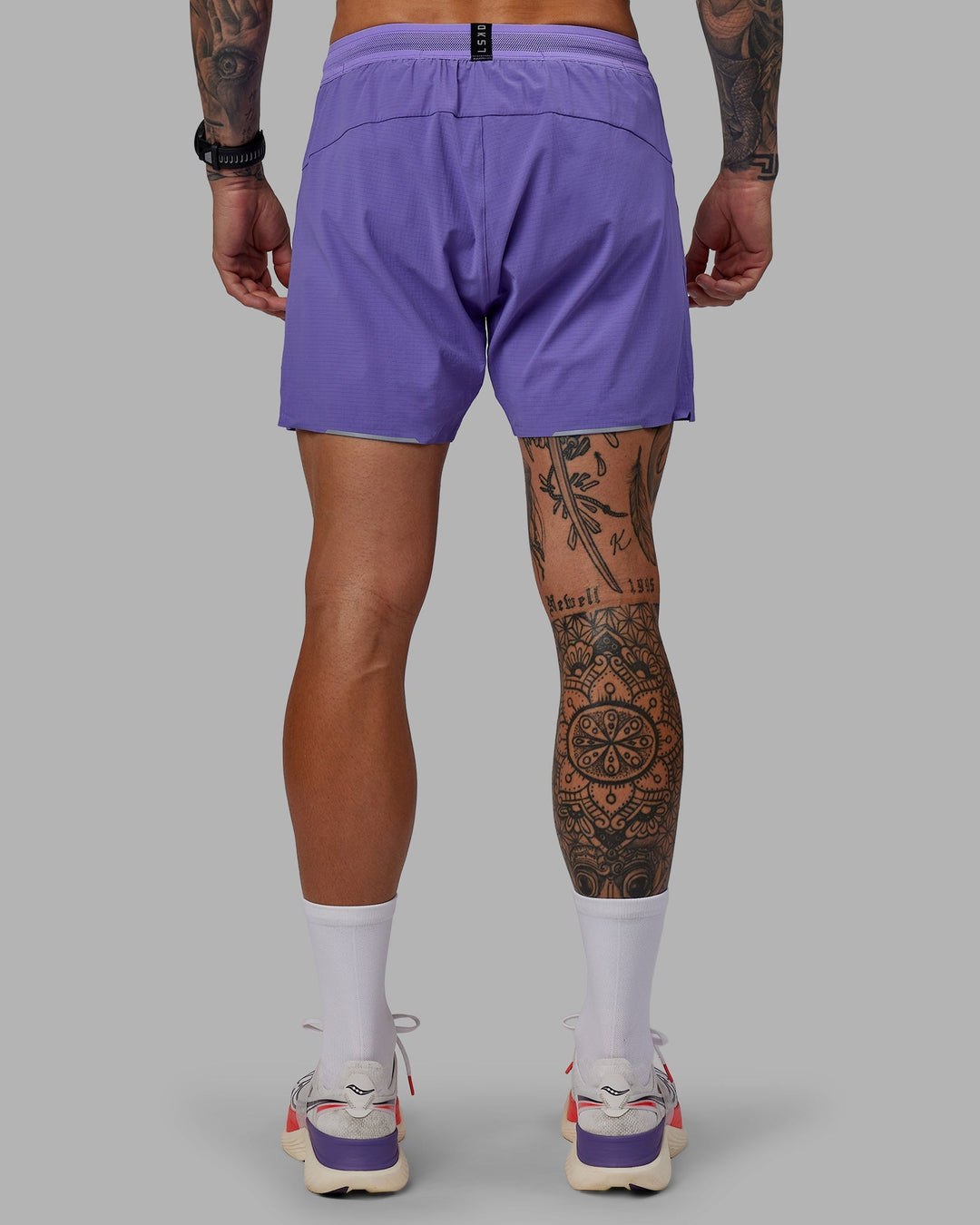 Man wearing UltraAir 5&quot; Lined Performance Shorts - Dahlia Purple