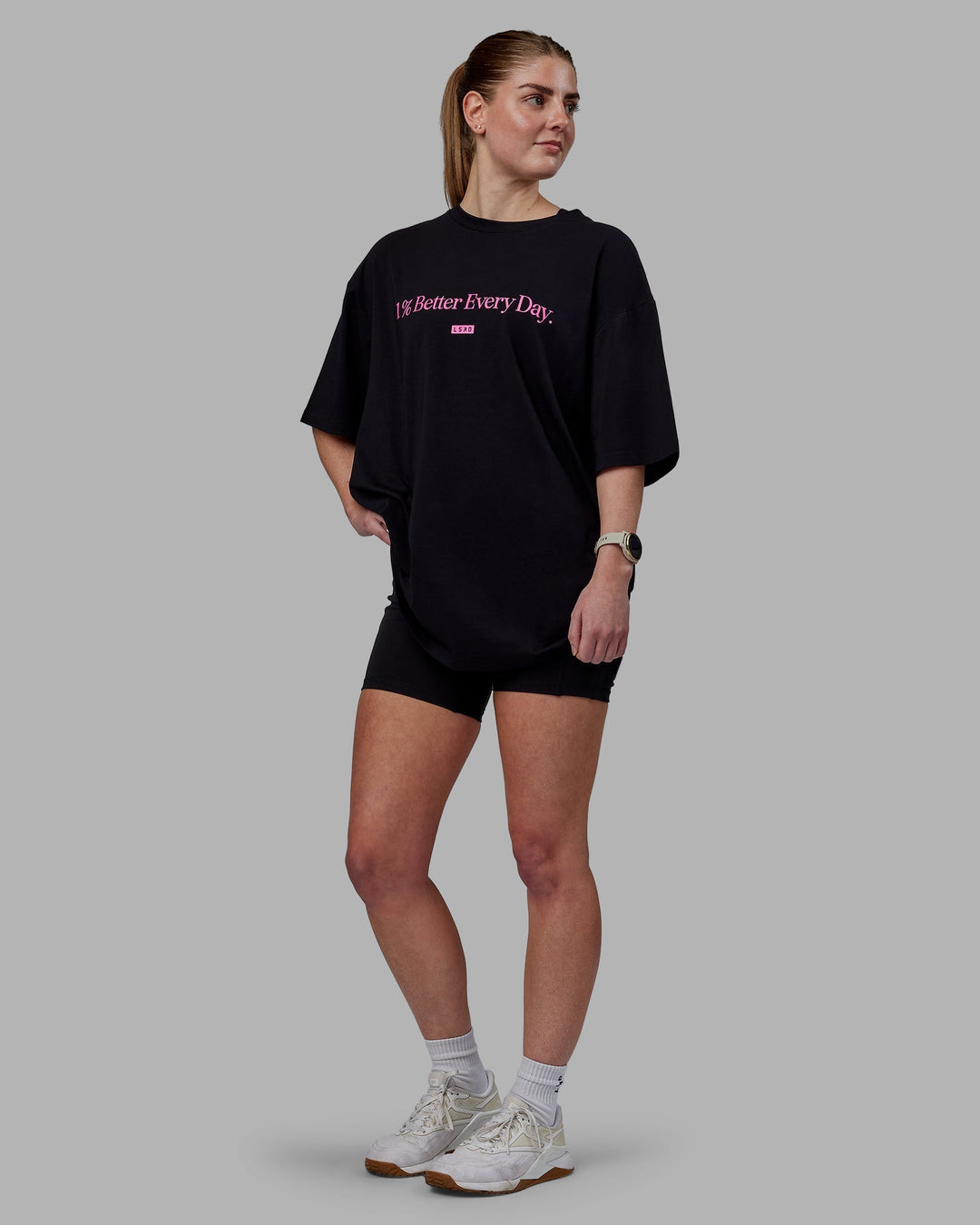 Woman wearing Unisex 1% Better FLXCotton Tee Oversize - Black-Fuschia Pink