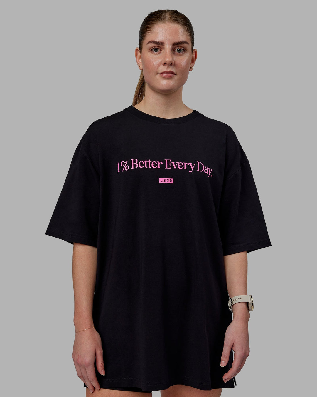 Woman wearing Unisex 1% Better FLXCotton Tee Oversize - Black-Fuschia Pink