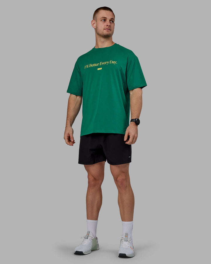 Man wearing Unisex 1% Better FLXCotton Tee Oversize - Green-Gold
