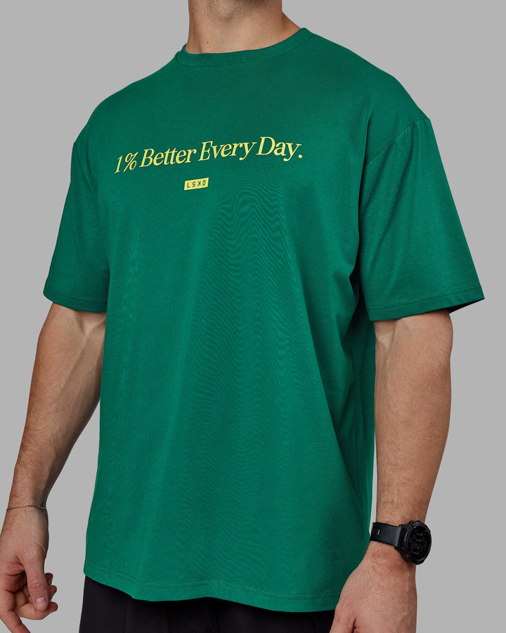 Man wearing Unisex 1% Better FLXCotton Tee Oversize - Green-Gold
