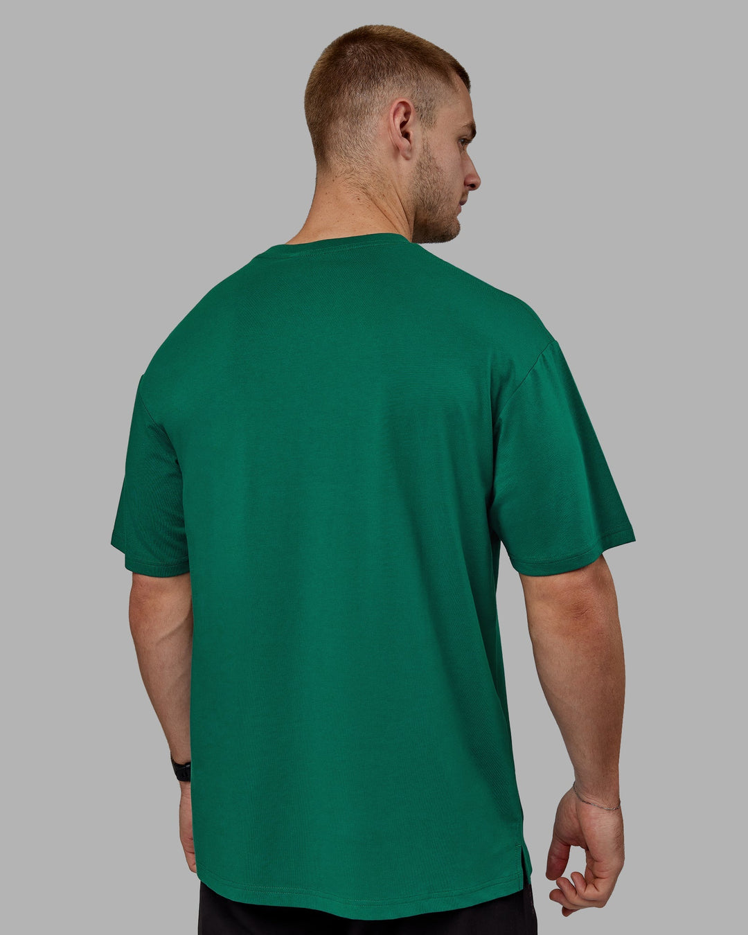 Man wearing Unisex 1% Better FLXCotton Tee Oversize - Green-Gold