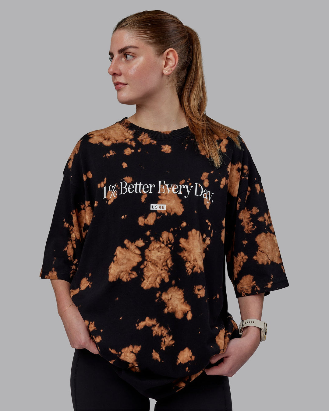 Woman wearing Unisex 1% Better Heavyweight Tee Oversize - Black-Bleach Tie Dye