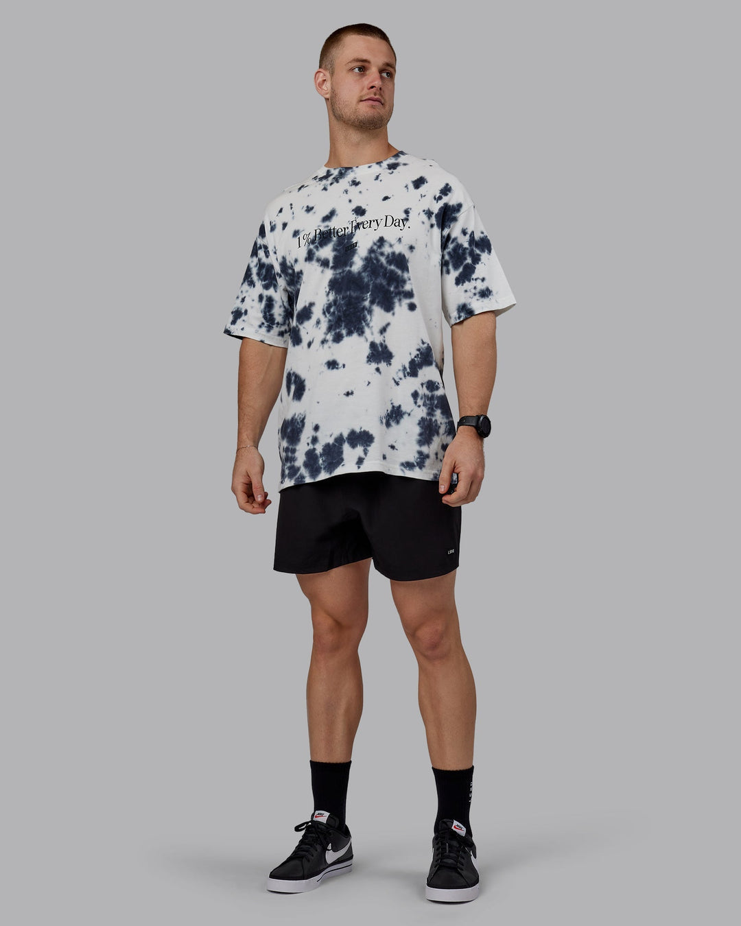 Man wearing Unisex 1% Better Heavyweight Oversize Tee - White-Black Tie Dye