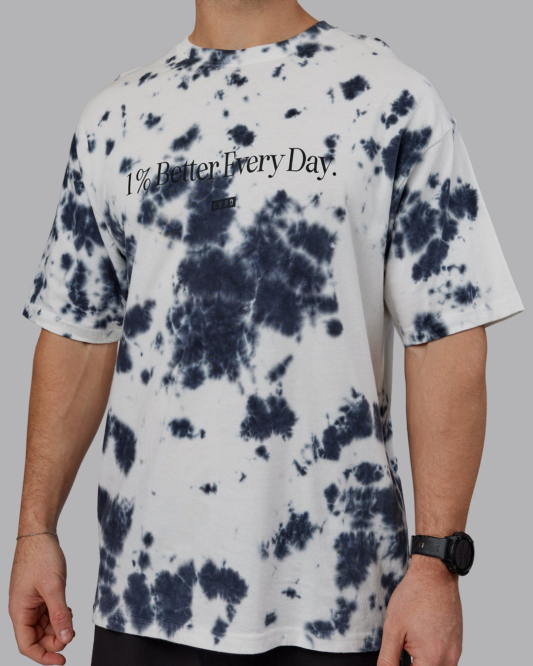 Man wearing Unisex 1% Better Heavyweight Oversize Tee - White-Black Tie Dye