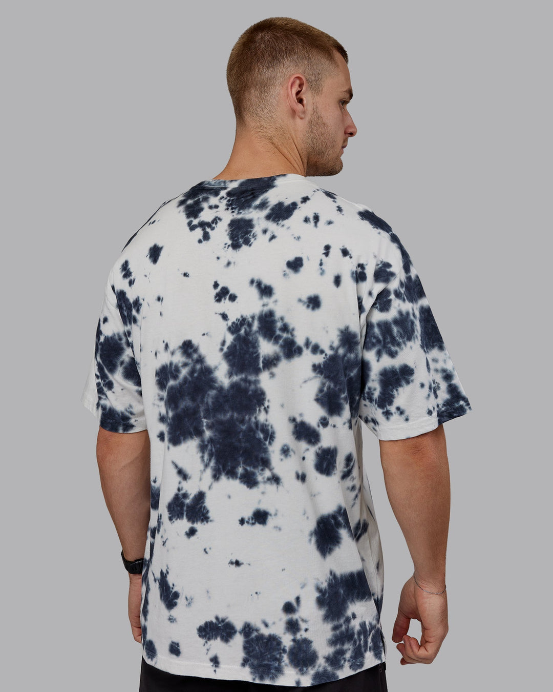 Man wearing Unisex 1% Better Heavyweight Oversize Tee - White-Black Tie Dye