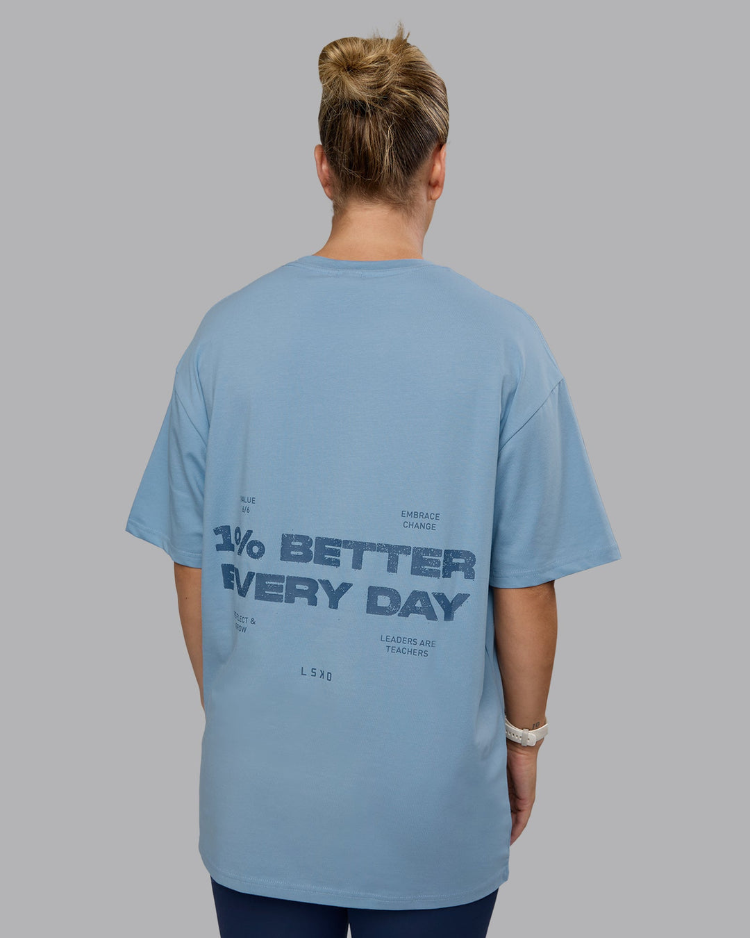 Woman wearing Unisex 1% Better Value Series FLXCotton Tee Oversize - Glacier Lake-Indigo