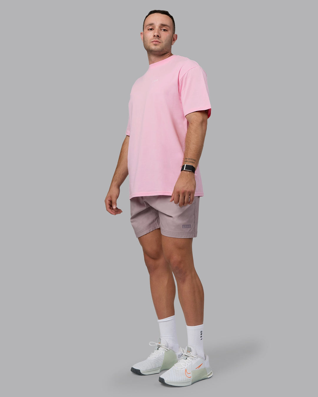 Man wearing Unisex 1% Better Value Series FLXCotton Tee Oversize - Pale Pink-White