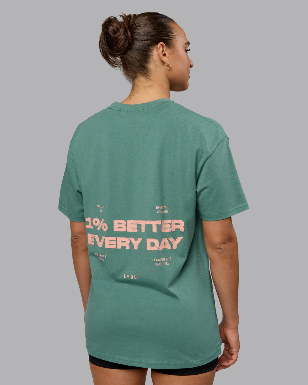 Woman wearing Unisex 1% Better Value Series FLXCotton Tee Oversize - Sagebrush-Mellow Peach